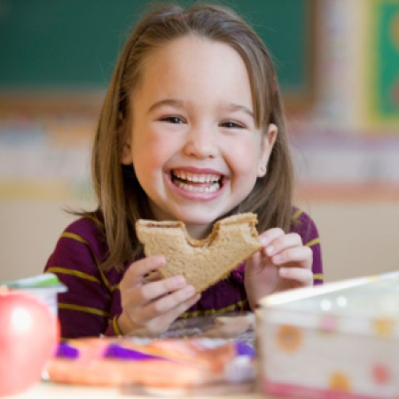Little Girl Eating Sandwich